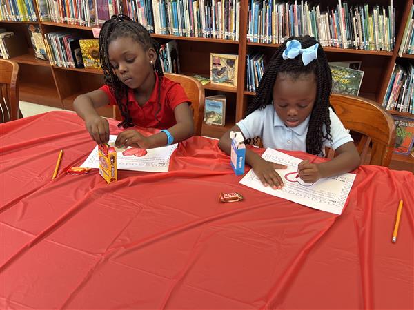 Two students coloring